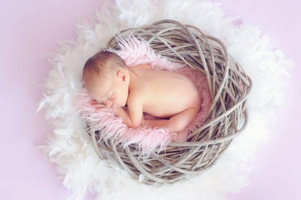 an infant in a newborn photoshoot